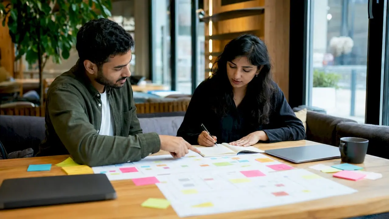 Colleagues collaborating on contact management features