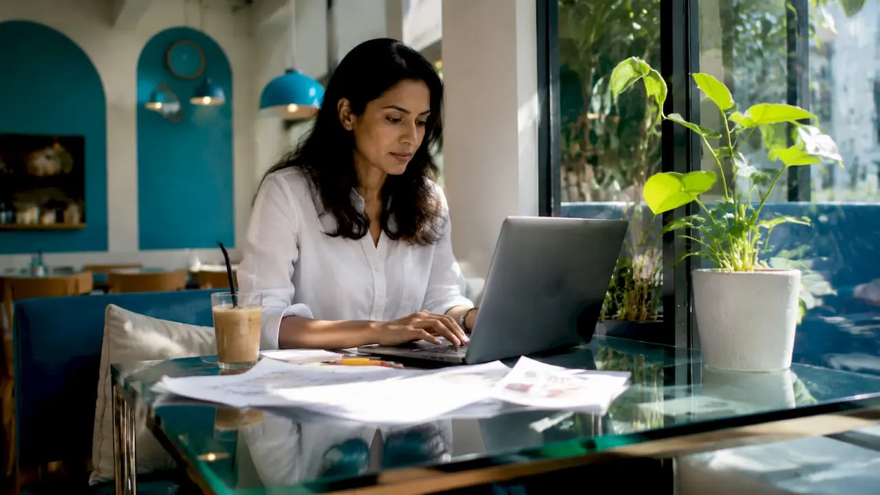 Woman setting up Shopify online store at desk