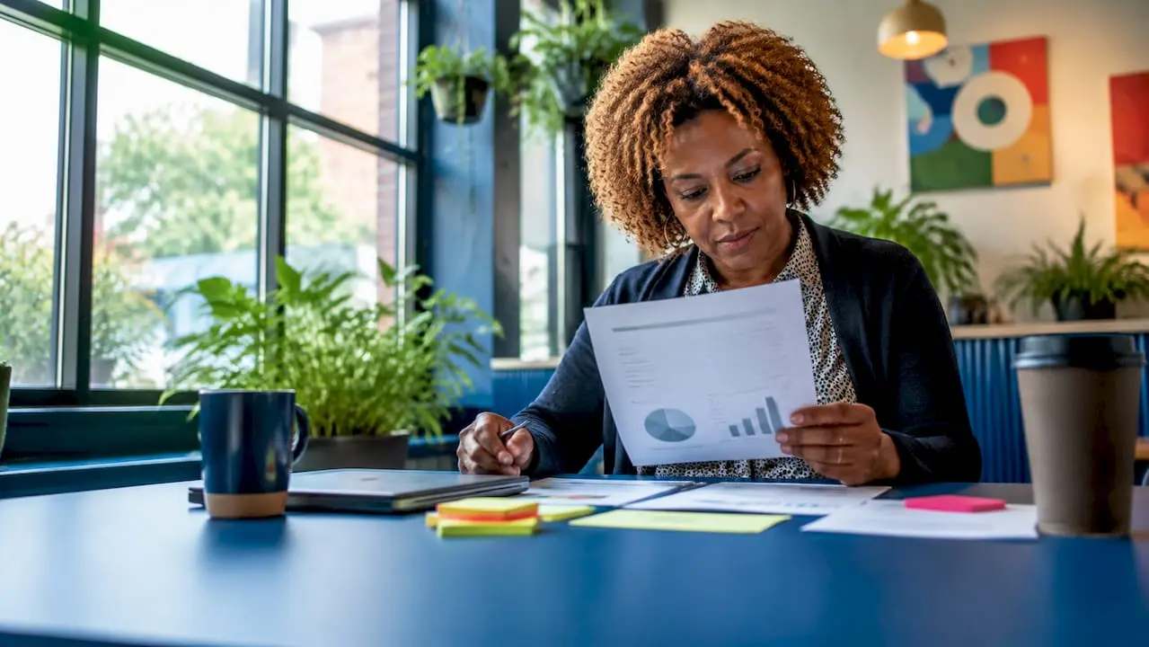 Woman reviewing membership fee strategy documents