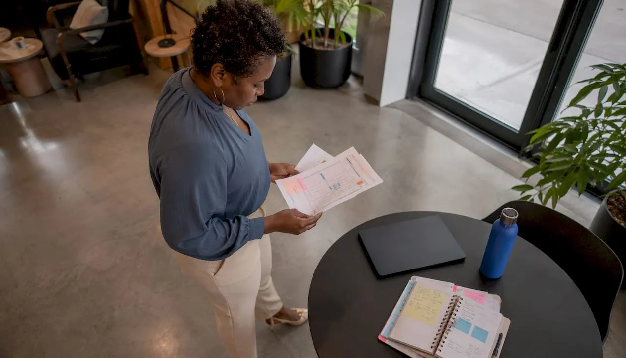 Woman reviewing database planning materials