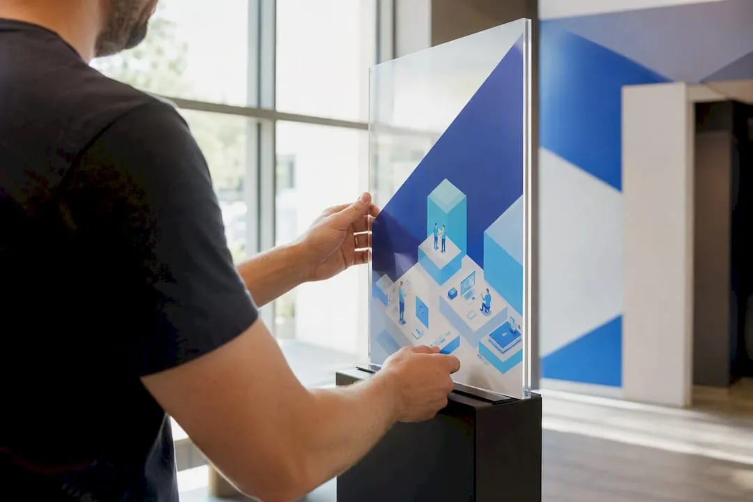 Hands adjusting membership price tags on display