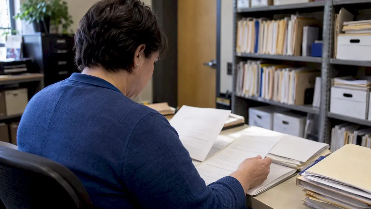 Coordinator reviewing charitable solicitation paperwork